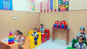 Dream Spire children seated in a bright classroom with colourful wall art